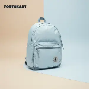 TORTKART Light Blue Converse-Style Backpack. Modern, waterproof bag with external pocket and patch logo, perfect for school, college, or casual travel.