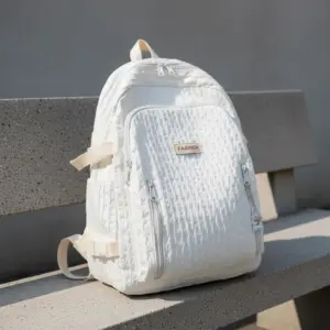 TORTKART Vibrant Purple Mini Backpack. Small fashion daypack or travel bag with a large front pocket, displayed against a colorful graffiti wall, perfect for street style and essentials.