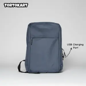 front view of a minimalist dark blue laptop backpack with a visible USB charging port on the side