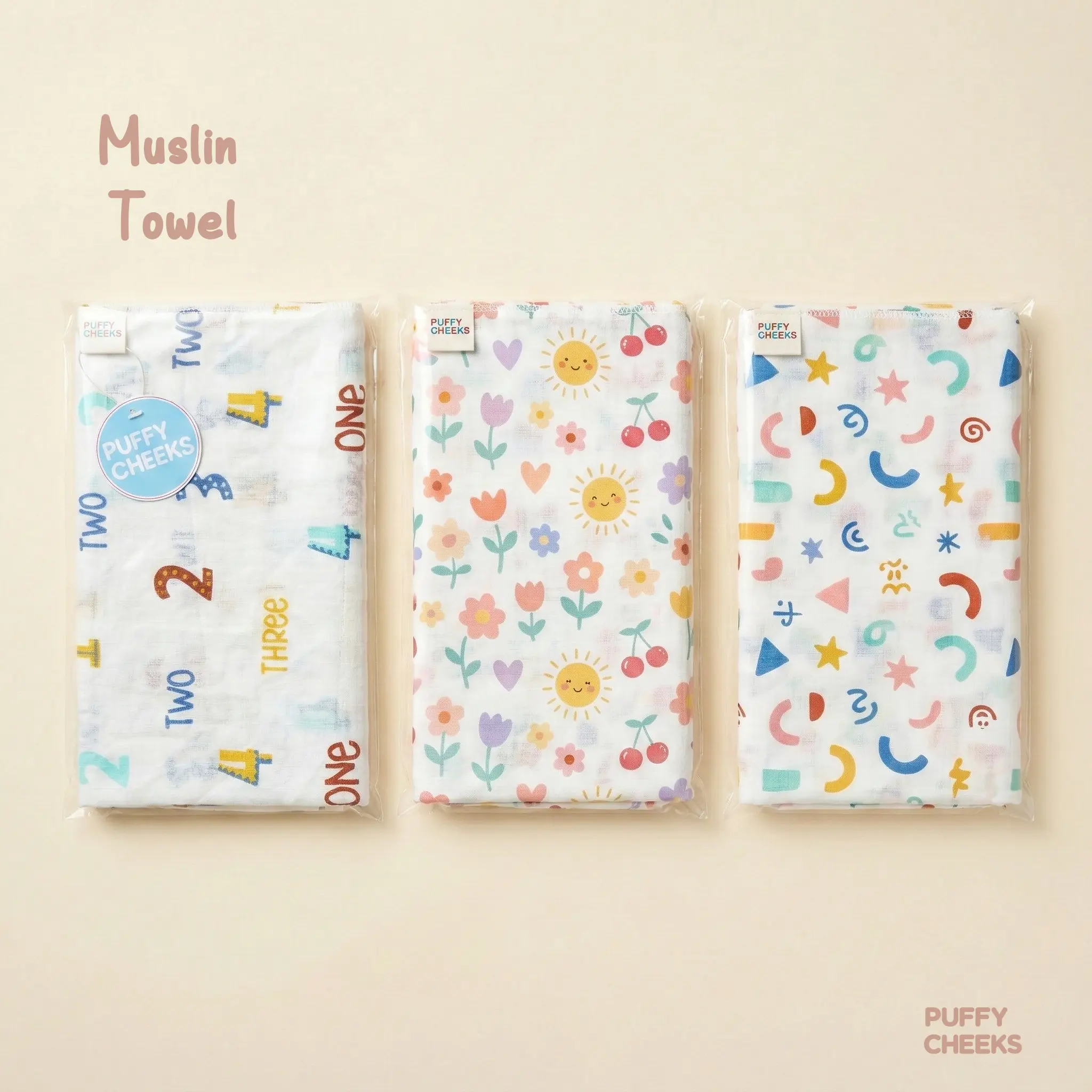 Small square soft yellow Puffy Cheeks muslin towel made of 100% cotton layered fabric, displayed on a neutral background with a decorative dried flower branch.