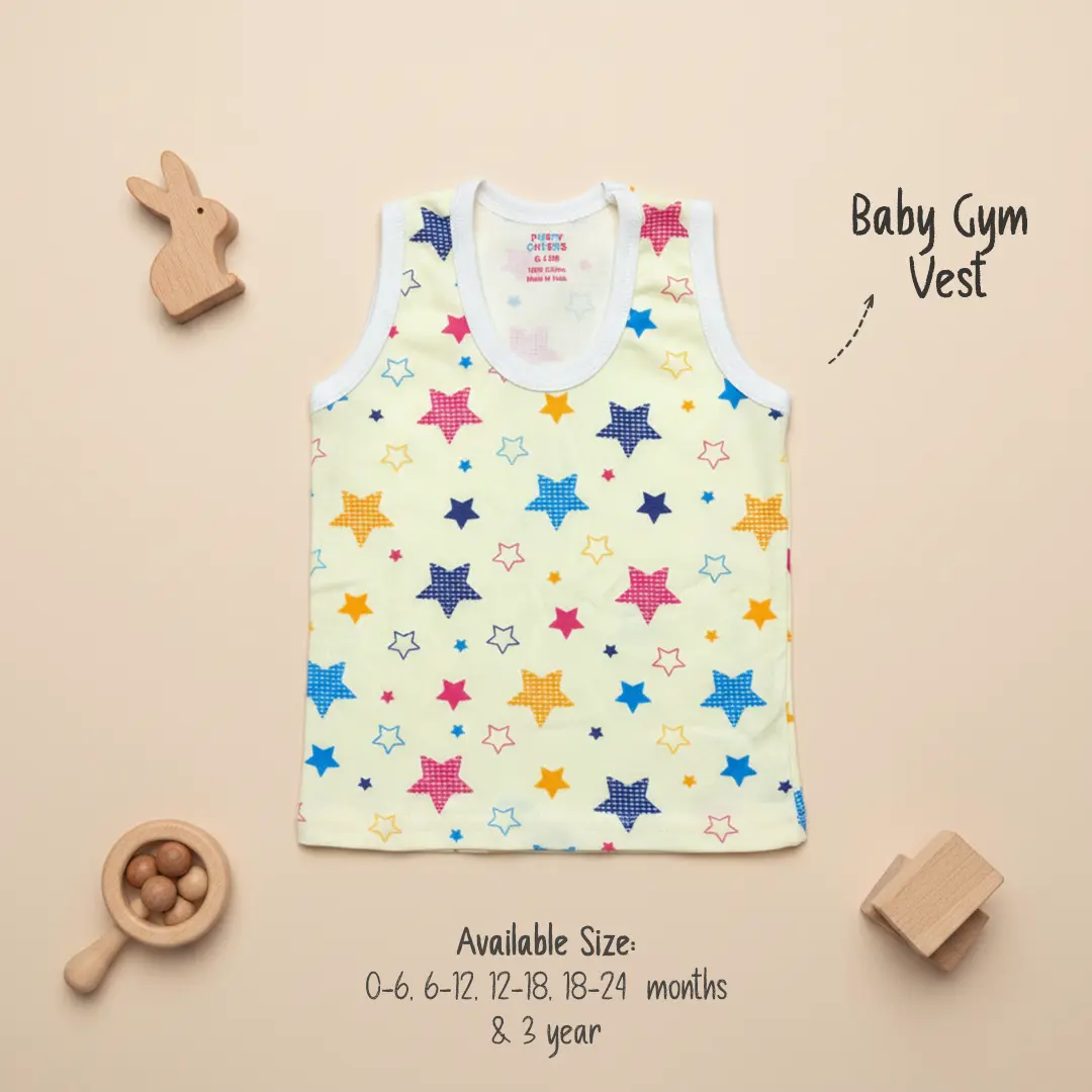 Light yellow Puffy Cheeks baby gym vest with white trim featuring an all-over print of colorful stars in pink, blue, orange, and purple, displayed on a beige background with wooden infant toys.