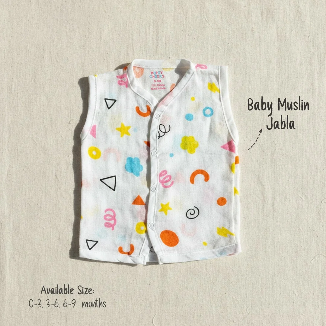 Puffy Cheeks baby muslin sleeveless jabla with bright geometric shapes, stars, and squiggles on white fabric.