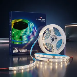 A retail box and a white plastic spool of Luker Vero 12V LED strip light illuminating a warm white glow on a reflective dark surface.