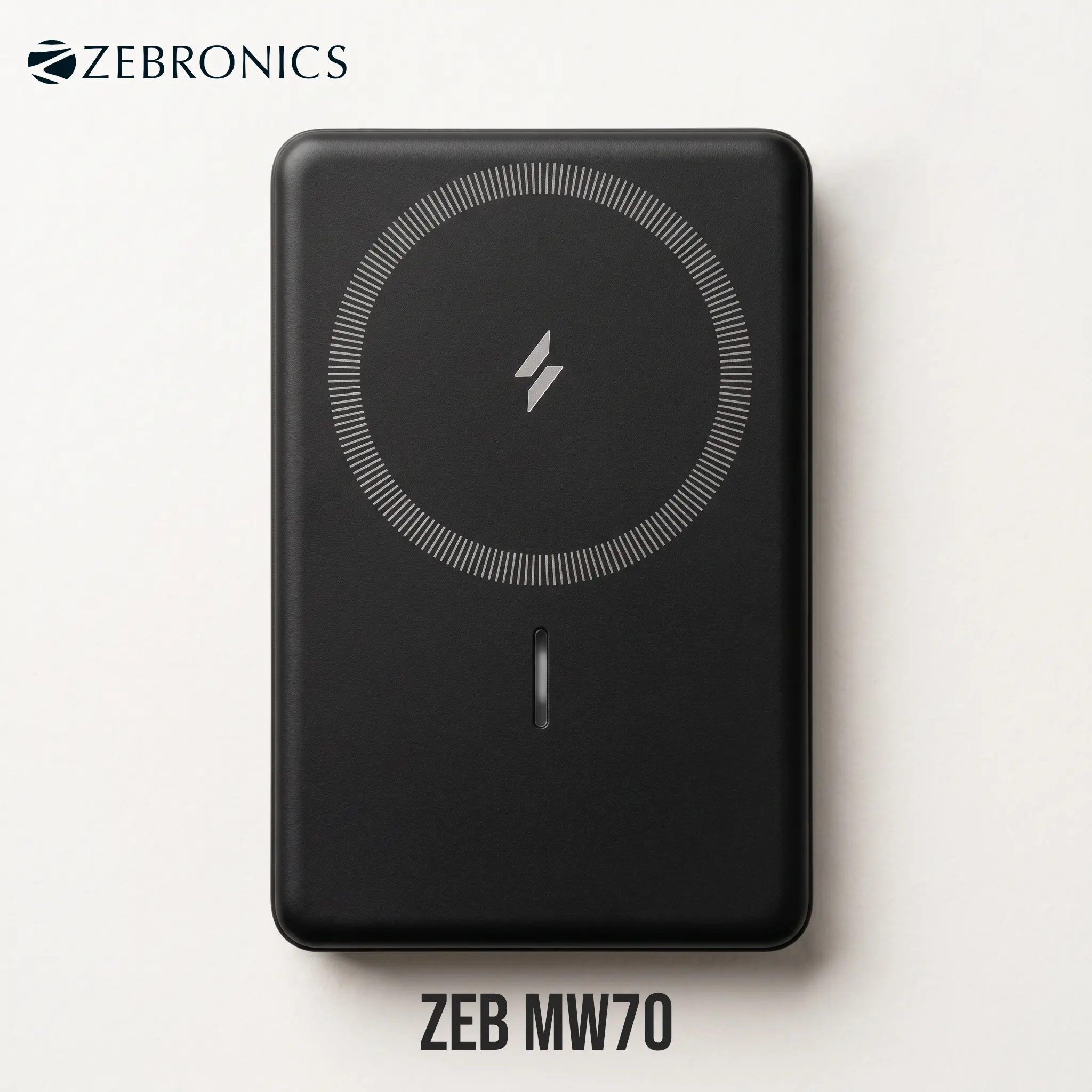 Top-down view of the black Zebronics ZEB-MW70 10000mAh power bank, showcasing its central magnetic wireless charging ring alignment pad and LED indicator on a clean off-white background.