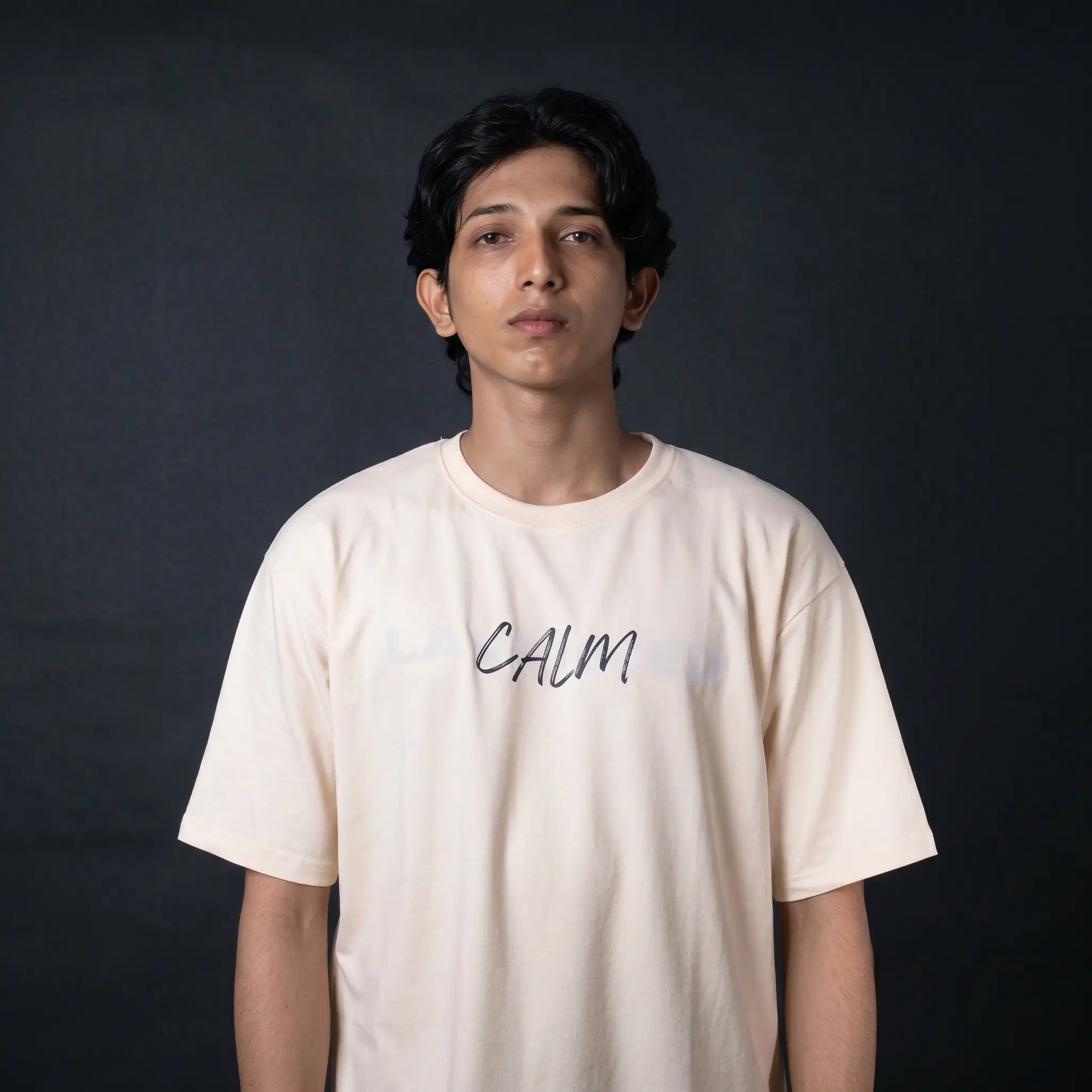 Detailed streetwear back graphic on Layered cream t-shirt featuring an orange flaming eastern dragon design with bold black typography.