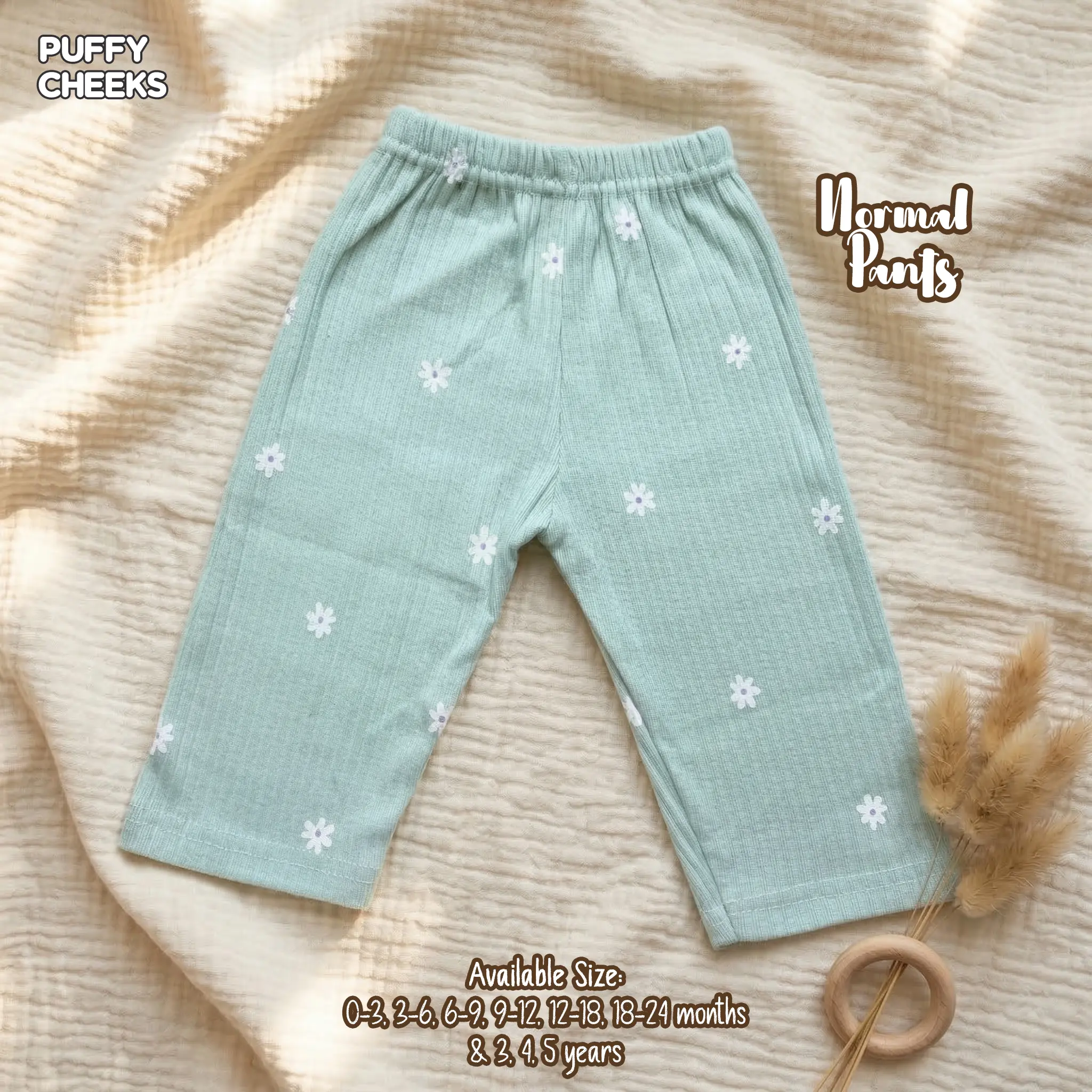 Puffy Cheeks light mint green textured normal pants for toddlers with delicate white daisy flower print.