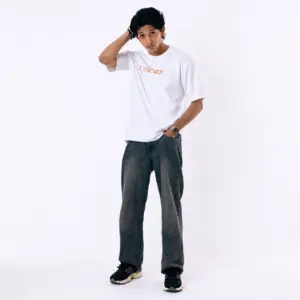 The primary goal of Alt Text is accessibility and image search optimization. It should clearly describe the image while weaving in high-value search terms naturally. Suggested Alt Text: Young man posing in the Laynered Premium White Loop Knit Drop-Shoulder Streetwear Tee paired with faded dark grey baggy jeans and black sneakers against a clean white studio background.